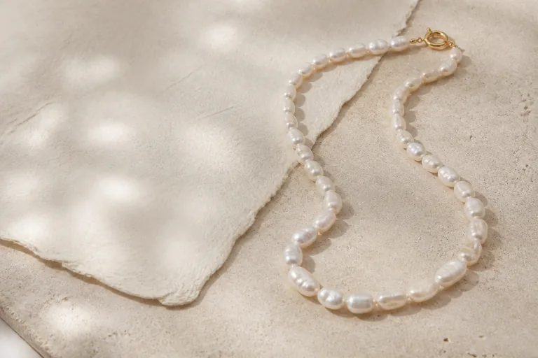 Irregular freshwater pearl necklace on warm stone